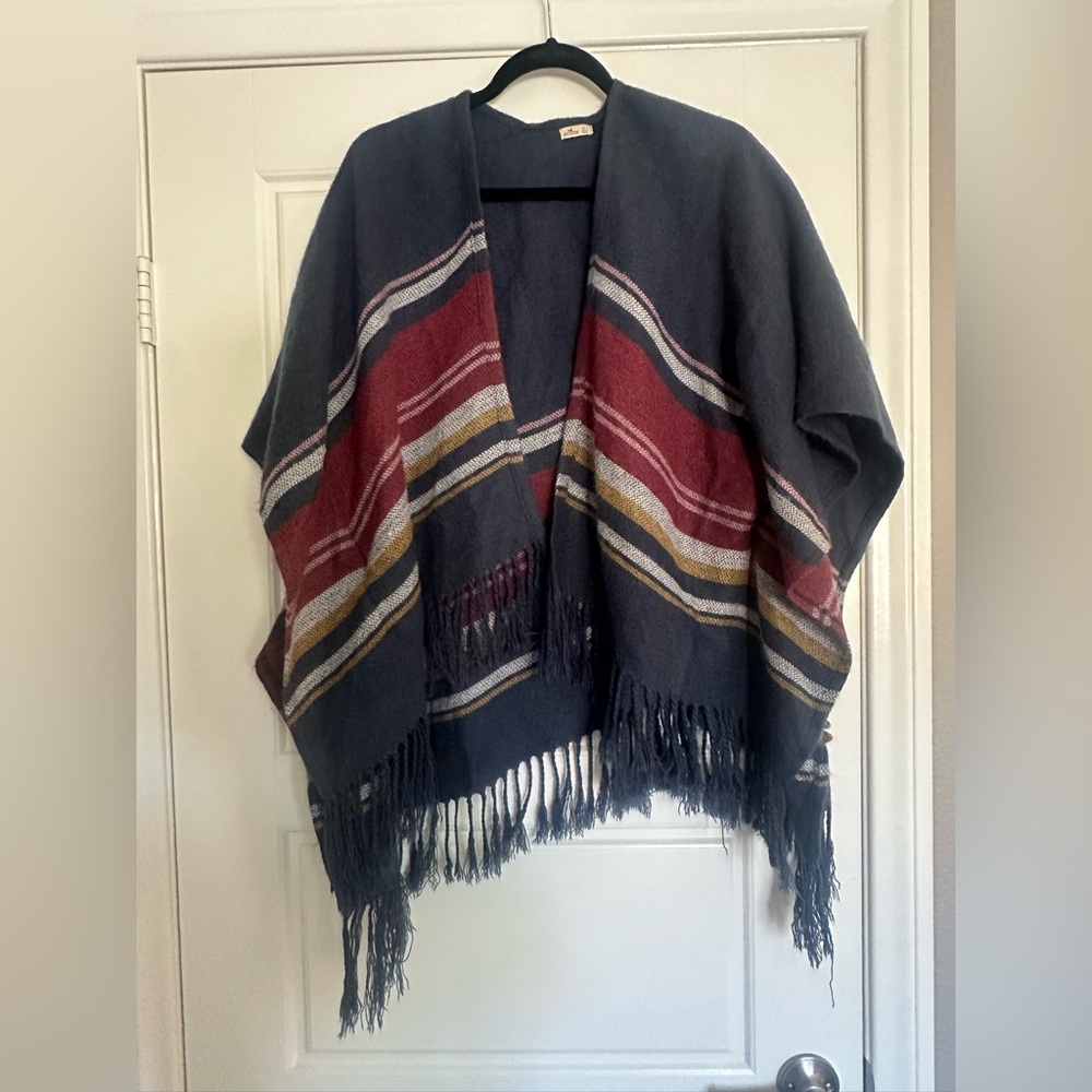Hollister Soft Knit poncho in Blue with stripes.